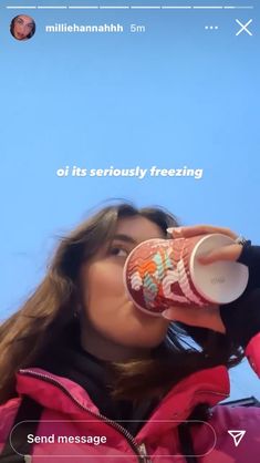 a woman drinking out of a cup while standing in front of a blue sky with the caption on it