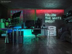 an office with neon lights and black furniture in the background, there is a large white sign that says follow the white rabbit