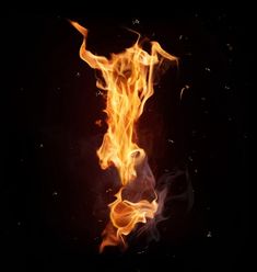 fire flames in the dark on a black background stock photo and royalty photoshopped