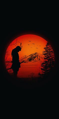 the silhouette of a person standing in front of an orange sunset