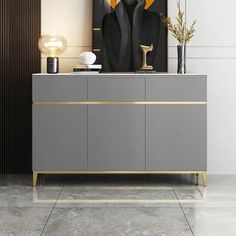 a modern sideboard with an abstract painting on the wall