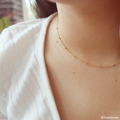 "Our satellite necklace is the perfect layering necklace that will complement everything. Dainty gold choker necklace. Perfect to wear alone or for layering with more necklaces. Feel free to contact me for details & options. Available also in silver: ♥https://www.etsy.com/il-en/listing/642368515/sterling-silver-ball-chain-necklace D e t a i l s: 14K Gold-filled satellite chain. Gold filled spring clasp and links ⊹ L e n g t h At checkout, please pick your desired length Length in the picture Trendy Gold Choker With Tiny Beads, Minimalist Gold Choker With Satellite Chain, Dainty Tiny Beads Choker For Everyday, Dainty Everyday Tiny Beads Choker, Dainty Tiny Beads Choker, Delicate Gold Choker With Tiny Beads, Dainty Gold Choker With Satellite Chain, Delicate Wedding Necklace, Satellite Necklace