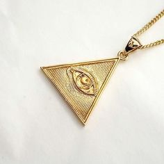 women's and men's triangle the Eye of Providence necklace pendant 2 made in 14k solid gold or 18k solid gold the eye of providence with exquisite details is on a triangle pendant. the Eye of Providence is a symbol that depicts an eye, meant to represent divine providence, whereby the eye of God watches over humanity. - this pendant height is 25.5mm without the bail. - model wears a 1.7mm 50cm chain. - materials: real 14k solid gold, real 18k solid gold - designed by carre d'or - made in South Korea 14k gold pendant necklace weight pendant only 3.94g (±3%) with a 1.4mm 42cm chain 6.80g (±3%) with a 1.7mm 42cm chain 8.02g (±3%) with a 2.1mm 42cm chain 9.90g (±3%) 18k gold pendant necklace weight pendant only 4.70g (±3%) with a 1.4mm 42cm chain 8.11g (±3%) with a 1.7mm 42cm chain 9.51g (±3%) 14k Gold Triangle Jewelry In Gold Color, Triangle Yellow Gold 14k Jewelry, 14k Gold Triangle Jewelry, 14k Gold Triangle Shaped Jewelry, Triangle Eye, Gold Necklace Pendant, Divine Providence, Eye Of Providence, Mens Necklace Pendant