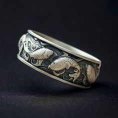 Japanese Koi Fish Mens Ring. Koi is a freshwater fish known for swimming against the current. The koi, which is extremely graceful despite swimming against the current, symbolizes success and perseverance in life for Far Easterners. MATERIALS: - Solid 925 sterling silver -bronze PRODUCTION METHOD: - Handmade with Care INTERNATIONAL SHIPPING: - We use International Priority Shipping Service - 5-10 Business Days - FREE Shipping PACKAGING: - All handmade sterling silver rings are nicely packaged ready to gift in elegant jewelry boxes. - Gift for him, gift for father's day MAKER GUARANTEE: - All items are 925k our silversmith maker hallmark stamped Mens Rings Silver, Japanese Ring, Pisces Jewelry, Silver Rings For Men, Japanese Jewelry, Mens Band Rings, Mens Silver Jewelry, Japanese Koi, Handmade Sterling Silver Rings