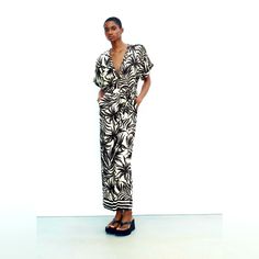 Printed Belted Jumpsuit V-Neck Jumpsuit With Short Cuffed Sleeves. Self Belt. Straight Leg. Front Button Closure. Ecru / Black | 9878/116 Composition Outer Shell 100% Viscose Chic Cream Jumpsuits And Rompers For Vacation, Chic Zara V-neck Jumpsuits And Rompers, Zara V-neck Jumpsuits And Rompers For Beach, Zara V-neck Beach Jumpsuits And Rompers, Zara V-neck Jumpsuits And Rompers For Day Out, Chic Zara Jumpsuits And Rompers For Vacation, Casual Cream V-neck Jumpsuits And Rompers, Casual Cream V-neck Jumpsuit, Black White Jumpsuit