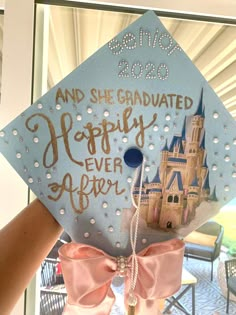 a blue graduation cap with the words and she graduated happily ever after