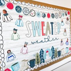 a large wooden sign that says sweater weather with pictures of people and snowflakes on it