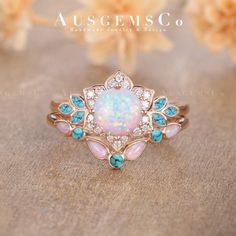 an opal and diamond ring with blue stones