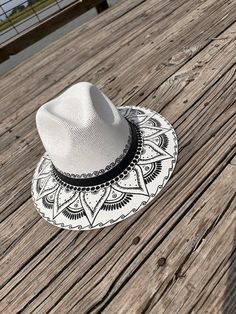 Don't miss your opportunity to own this one of a kind hand painted hat. The detailing is impressive. Perfect for a day at the beach, a sporting good outing or everyday use. Perfect for adding an extra special touch to your outfit. Size is Medium Adjustable Hand Painted Fedora With Curved Brim, Adjustable Wide Brim Hand Painted Hats, Artistic Panama Hat With Adjustable Flat Brim, Hand Painted Adjustable Fedora, Custom Hand Painted Adjustable Fedora, Adjustable Hand Painted Brimmed Hat, Bohemian Hand Painted Adjustable Hat, White Hand Painted Flat Brim Hat, Adjustable Bohemian Hand Painted Hat