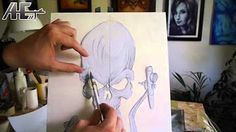 someone is drawing a skull on a piece of paper