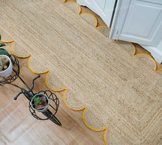 a pair of planters sitting on top of a wooden floor next to a door