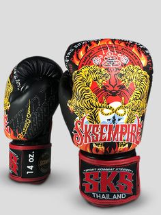 two black and red boxing gloves with designs on them