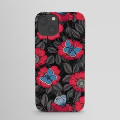 an iphone case with red and blue flowers on it, sitting against a gray background