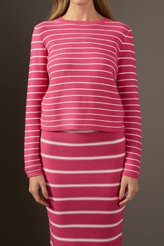 Our Round-neck Striped Sweater is the perfect way to stay cozy and chic. With a classic round neckline long sleeves and a pullover silhouette this stylish piece has all you need for cold weather. The striking stripes make it the perfect choice for those seeking a fashionable yet comfortable look. Its quality fabric is sure to keep you warm and looking great all season long. Get this must-have sweater now and elevate your style game. Stripe Round neckline Long sleeves Pull over Hand wash cold Do not bleach Do not tumble dry Iron low Shell: 60% Cotton 40% Acrylic JJ2610T Total length:20.5" Bust:35.5" S PINK/WHITE: Height 5'10.5" / Bust 32" / Waist 24" / Hip 36.5" BLACK/WHITE, TAN/BLACK: Height 5'9" / Bust 32" / Waist 24" / Hip 34" Striped Stretch Knit Top With Crew Neck, Stretch Crew Neck Top With Contrast Stripes, Striped Fine Knit Crew Neck Top, Striped Long Sleeve Fine Knit Sweater, Striped Cotton Sweater With Ribbed Detail, Summer Style Guide, Casual Party Dresses, Maxi Dress Sale, Fashion Night