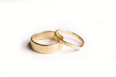 The gold Bark Wedding Band set complements each other in their simple, understated beauty. Hers is a delicate, hand-formed, lightly hammered, while his hand-hammered band measures a substantial 6mm. Elegant and modern, with just a touch of rusticity. Wedding Ring Sets Simple, Nature Details, Couple Wedding Rings