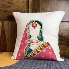 a decorative pillow with an image of a woman on it