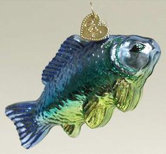 a glass fish ornament hanging from a hook