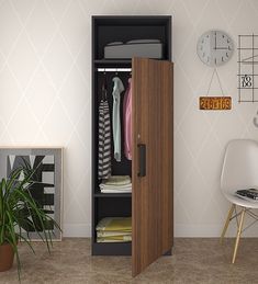 an open closet with clothes on hangers and a chair in the corner next to it