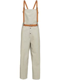 Prada Cropped Leather Overalls - Farfetch Utility Overalls With Belt Loops For Workwear, Utility Overalls With Adjustable Straps For Workwear, Utility Overalls With Suspenders For Workwear, Beige Workwear Overalls, Beige Overall Bottoms With Pockets, Prada Pants Women, Prada Jumpsuit, Leather Overalls, Leather Shorts Farfetch