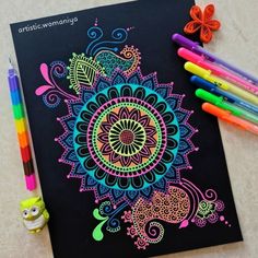 an adult coloring book with markers and crayons