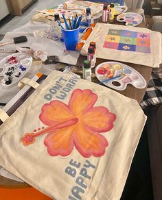 the table is covered with various art supplies