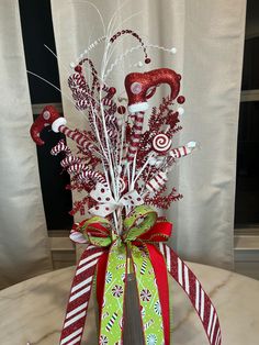 a christmas centerpiece with candy canes and candies