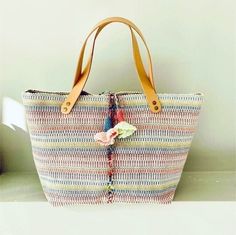 "A Sunday in the countryside" Tote bag in multicolored woven canvas in pastel colors. Fringed finish. raw linen interior. One interior pocket. 2 drawstrings with crocheted eyelets. Riveted natural leather handles. Dimensions: H 33 cm.  L 45 cm. handle length 42 cm Cotton Straw Tote Bag For Everyday Use, Cotton Tote Straw Bag For Daily Use, Everyday Woven Cotton Straw Bag, Multicolor Casual Beach Bag With Leather Handles, Casual Multicolor Beach Bag With Leather Handles, Bohemian Multicolor Canvas Bag, Multicolor Canvas Bag With Leather Handles For Shopping, Multicolor Woven Bags For Shopping, Multicolor Woven Shopping Bags