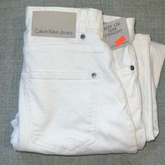 Brand New Men's Calvin Klein Slim Straight White Jeans Zip Fly. New With Tags. Size 29 X 30. White Slim Fit Casual Jeans, Straight White Jeans, Fitted White Calvin Klein Boxer Briefs, Calvin Klein Jeans Mens, Cheap White Men's Jeans, Calvin Klein White T-shirt For Streetwear, White Calvin Klein, Clueless Outfits, Jeans White