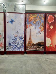 four panels painted with flowers and the eiffel tower in paris, on display