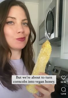 a woman holding a banana in her hand and looking at the camera with an ad on it that says, but we're about to turn corn corrobs into vegan honey