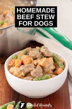 homemade beef stew for dogs in a white bowl with green beans and carrots on the side