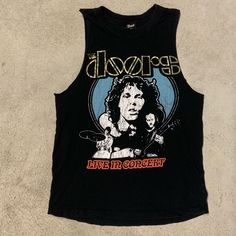 Great The Doors Concert Tee Size: Small Like Brand New Black Edgy Tops For Music Festivals, Casual Black Tops For Music Festivals, Casual Black Top For Music Festivals, Edgy Black Top For Music Festival, Black Grunge Tops For Music Festivals, Black Cotton Top For Music Festivals, Black Grunge Top For Music Festivals, Edgy Festival Tops, Black Band Merch Top For Music Festivals