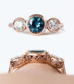 Vintage Engagement Ring/London Blue Topaz Wedding Bridal Ring/Vintage Art Deco bezel Ring/Antique Blue Sapphire Ring/Round Three Stone Ring 𝐂𝐞𝐧𝐭𝐞𝐫 𝐒𝐭𝐨𝐧𝐞 𝐃𝐞𝐭𝐚𝐢𝐥𝐬 ↣ Shape : Round Cut ↣ Size : 6 MM ↣ Color : Blue ↣ Clarity : vs ↣ Luster : excellent ↣ Make : high quality ✥ 𝐒𝐢𝐝𝐞 𝐒𝐭𝐨𝐧𝐞 𝐃𝐞𝐭𝐚𝐢𝐥𝐬 ↣ Stone : Moissanite ↣ Shape : Round Cut ↣ Color : DEF White (Color Less ) ↣ Clarity : VVS ↣ Luster : excellent ↣ Make : high quality ↣MOHs scale : 9.25 ↣Moissanite Refractive index : 2.65 ↣ Metal : rose gold - yellow gold -white gold - 925 silver ↣ Making Process : Handmade - crafted by our experienced team ↣ Metal Stamp : yes ✥ 𝐅𝐫𝐞𝐞 𝐄𝐧𝐠𝐫𝐚𝐯𝐢𝐧𝐠 The stones in jewelry are 100% hand-crafted it is cut and polished by our experienced craftsman. Provide you with the Scroll Engagement Ring, Circle Symbol, Vintage Art Deco Rings, Bezel Engagement Ring, Scroll Work, Vintage Engagement Ring, Blue Sapphire Ring, Bezel Ring, Montana Sapphire