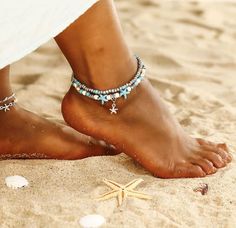 A stunning double layered beach anklet. Our beach anklets have been made with a tropical paradise in mind, dotted with blue and white starfish and paired with a simple beaded layer. Choose from a starfish, shell, whale, tree, wave or turtle charm. If you would like to view our other body jewellery items please click the link below. https://www.etsy.com/uk/shop/CollectionsbyHayley?ref=shop_sugg&section_id=15529913 All Collections by Hayley jewellery will be lovingly hand wrapped and packaged with Bohemian Beach Style, Starfish Anklets, Star Anklet, Beach Jewellery, Starfish Jewelry, Beaded Ankle, Stella Marina, Boho Layering, Beach Anklets