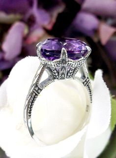 Natural Purple Amethyst Ring  100 Year Design#37 Introducing our stunning Natural Amethyst Ring, expertly crafted with 5ct round cut natural amethyst set in a solid sterling silver Edwardian filigree setting. This exquisite ring features a gorgeous 12mm Natural Purple Amethyst gemstone, with a beautiful crown-like design on the filigree setting and etched band.  Each ring is marked with a 925 stamp, ensuring its authenticity and high quality. This is a faithful reproduction of an original ring f Antique Amethyst Ring With Center Stone, Art Deco Oval Amethyst Wedding Ring, Oval Amethyst Art Deco Wedding Ring, Oval Amethyst Ring For Wedding In Art Deco Style, Classic Amethyst Wedding Ring With Diamond Cut, Ornate Round Purple Amethyst Ring, Vintage Amethyst Ring With Round Cut, Antique Amethyst Ring With Prong Setting For Wedding, Vintage Amethyst Ring Round Cut