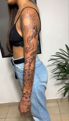 a woman with a tattoo on her arm