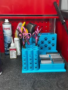 the items are organized neatly on the shelf in the storage area, including scissors and combs