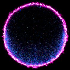 an image of the center of a circle that is filled with pink and blue lights