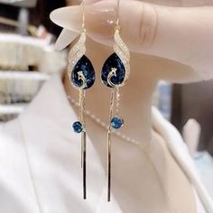 SPECIFICATIONS Features: Fashion,elegant,peacock design Item Types: Earrings Metal Material: S925 silver Total Weight: 0.066lbs Gem Type: Lab-Created Stone Stone Cut: Pear Cut Primary Stone Color: Blue/Red Side Stone Color: Blue/Red Size: 1.97*0.78*3.94in NOTE: Items are handmade, please allow for very minor variations, and the colors may vary from screen to screen. Peacock Earrings, Magical Jewelry, Fancy Jewellery, Fancy Jewelry, Fantasy Jewelry, Girly Jewelry, Bride Jewellery, Samoa, Bridal Jewelry Sets