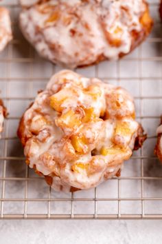 several pastries are cooling on a wire rack