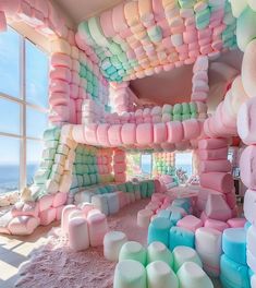 a room filled with lots of different colored marshmallows on the floor and walls