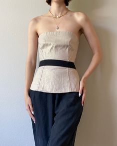 "Vintage Dolce Gabbana/D&G beige linen blend bustier top. Metal Zipper closure in the back. size Small, IT40. excellent vintage condition. *Models measurements: size XS, bust 32, waist 24\", hips 35\". *Please note that natural signs of wear are normal for vintage, pre-loved clothing. All items hand-picked by Alizée Garments are carefully inspected and are high quality pieces that have stood the test of time. *all items will be washed/cleaned before shipping." Elegant Linen Party Tops, Chic Summer Overbust Tube Top, Chic Overbust Tube Top For Summer, Chic Beige Party Corset, Chic Beige Corset For Party, Vintage Fitted Linen Top, Vintage Sleeveless Top With Boned Bodice, Fitted Vintage Linen Top, Chic Fitted Cream Corset