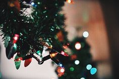 a christmas tree with lights and decorations on it