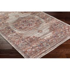 an area rug with wood flooring and wooden floors in the background, it is made from