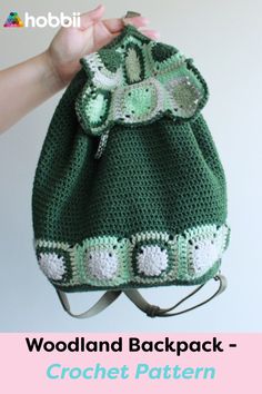 a crochet bag with the words woodland backpack written in white and green on it