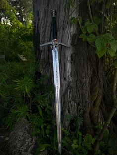 "Introducing the Black Witcher Sword: Channel the essence of Geralt of Rivia with our meticulously crafted masterpiece. A sleek, jet-black blade, adorned with enchanting engravings, rests in your grasp. Balanced leather-wrapped hilt, intricate crossguard, and pommel echo the valor and danger of the witcher's path. Display it proudly or wield it fiercely - a symbol of power and artistry. Unleash your inner monster hunter; order the Black Witcher Sword today. Sword Details:                 Total Length : 39\"                 Hilt Size : 11\"          Handle Size : 6\"         Handle Material : Wood with leather wrap         Pommel : 2\" High Carbon Steel         Guard Dimensions : 3\" X 9\"         Guard Material : High Carbon Steel                 Blade Size : 2.25\" X 28\"         Blade Ma Witcher 3 Swords, Witcher Swords, Swords, Types Of Swords, Swords Medieval, Geralt Of Rivia, Cool Swords, High Carbon Steel, The Witcher