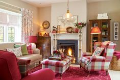 a living room filled with furniture and a fire place