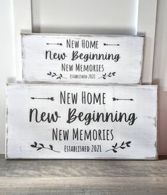 two wooden signs that say new home, new beginning and new memories on the front