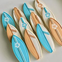 decorated cookies in the shape of surfboards