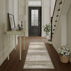 the hallway is clean and ready to be used as a place for an entryway